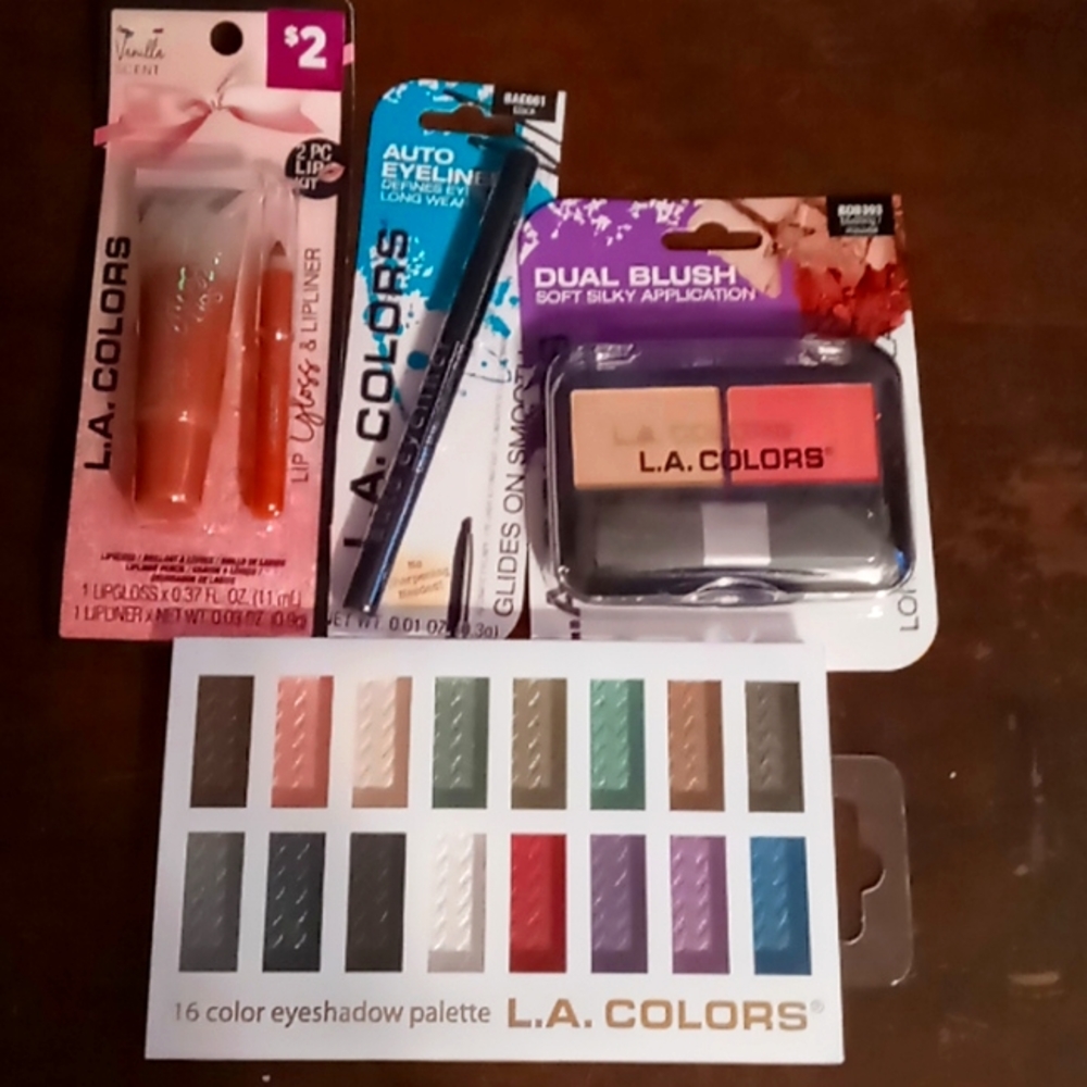 Make up assortment lip gloss, eye liner, eye shadow, blush great deal make up by